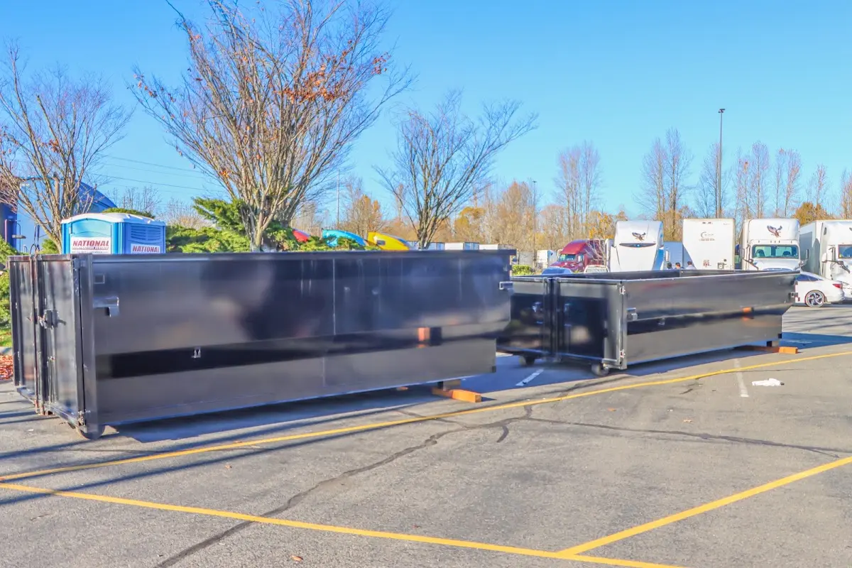 Professional dumpster rental service with roll-off container on residential driveway in Vadnais Heights